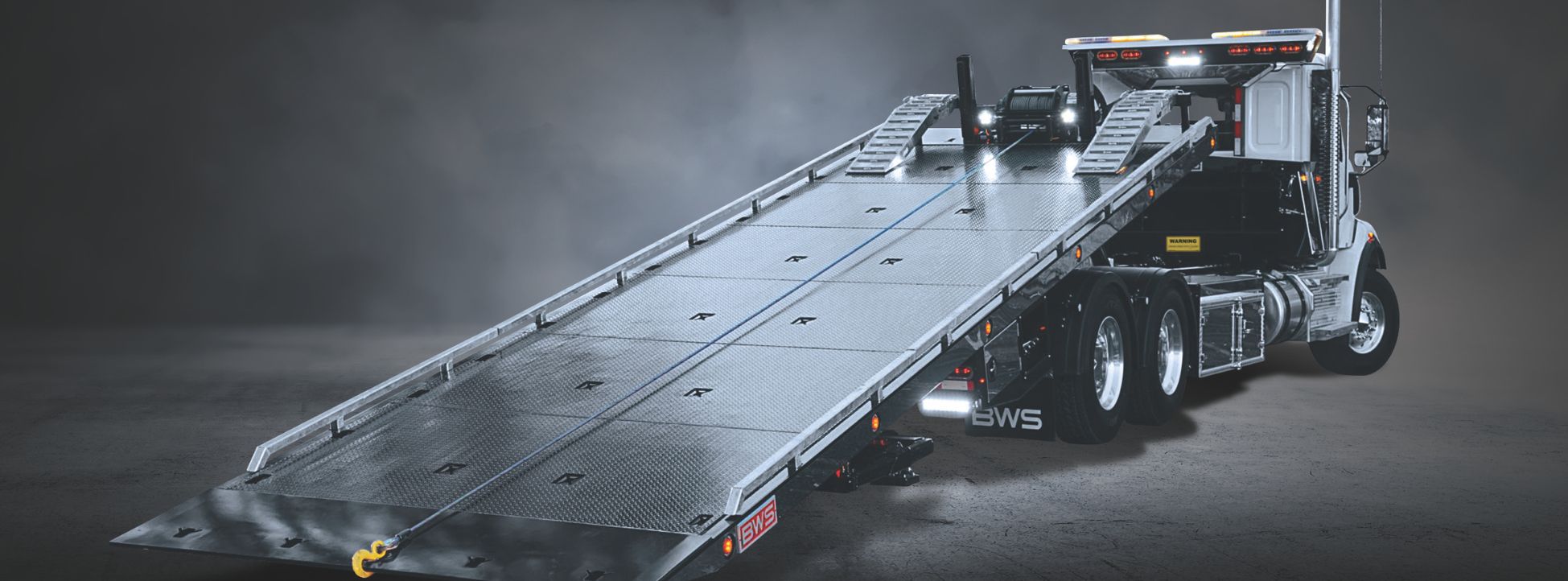 BWS 40 TDP tow deck platform loading heavy equipment with extended steel deck and winch system