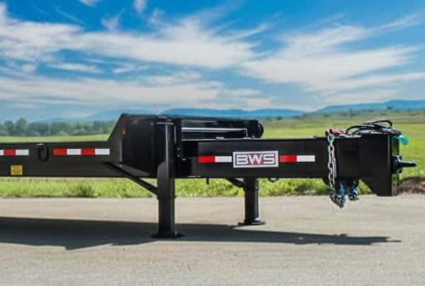 BWS tag-along trailer with dual landing gear legs supporting fully loaded trailer
