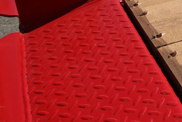 close-up of BWS trailer industrial-grade paint coating on anti-slip steel deck surface